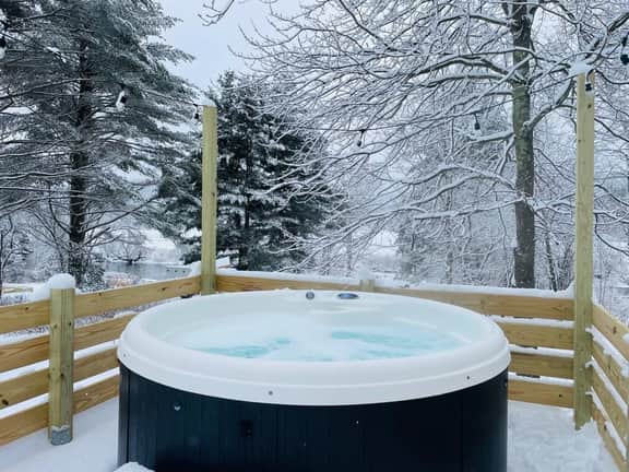 Caboose Tiny Home on river with hot tub near Stowe