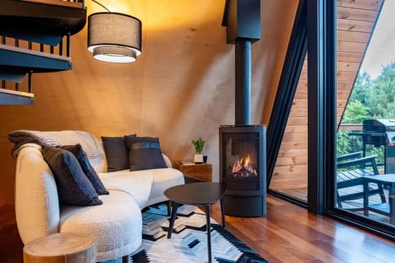Designer A-Frame Treehouse with hot tub on river